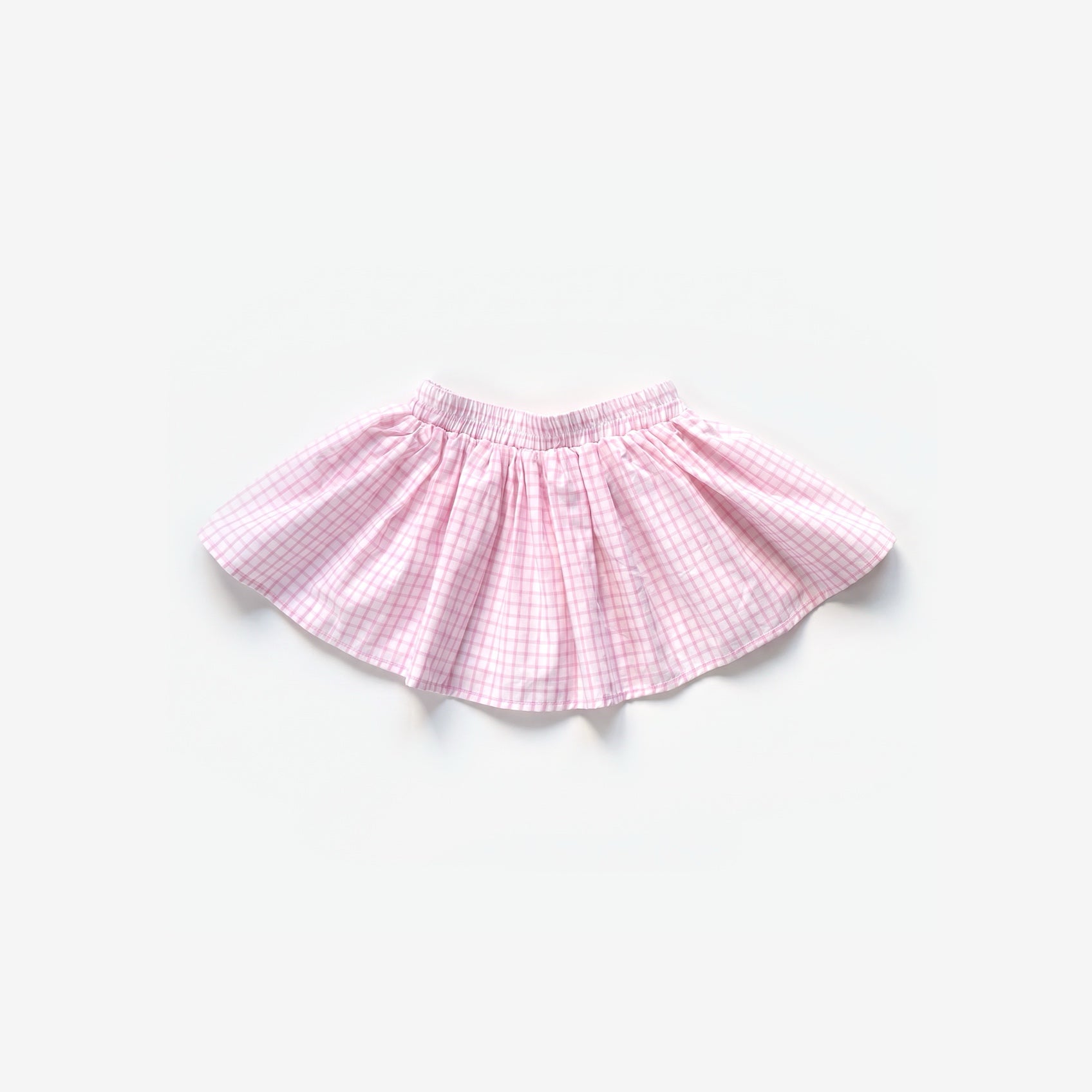 Bahia rok roze ruit, flat lay op een lichtgrijze achtergrond | Club Cinq