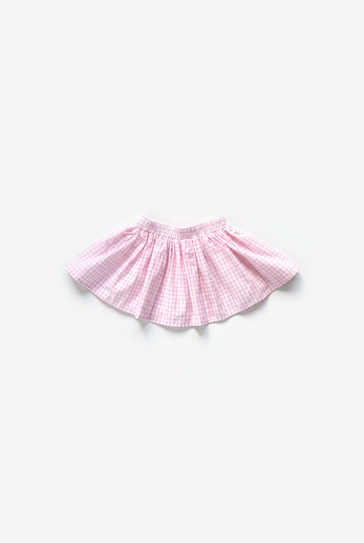 Bahia rok roze ruit, flat lay op een lichtgrijze achtergrond | Club Cinq